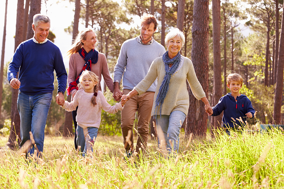 Photo of family walking through nature